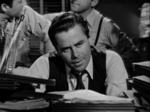 Frank Warren (Glenn Ford) pores over financial records in Joseph H. Lewis' The Undercover Man (1949)
