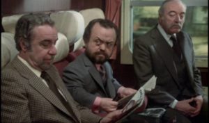 Fellow passengers take an interest in Mathieu (Fernando Rey)'s behaviour in Luis Bunuel's That Obscure Object of Desire (1977)