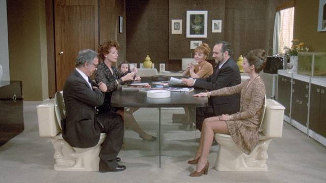 Defecation is a social activity while eating is shamefully hidden in Luis Bunuel's The Phantom of Liberty (1974)