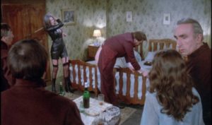 The businessman (Michael Lonsdale) enjoys public humiliation from his dominatrix (Anne-Marie Deschodt) in Luis Bunuel's The Phantom of Liberty (1974)