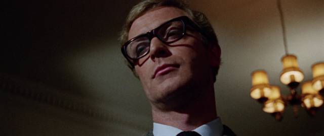 Harry Palmer (Michael Caine) exudes disdain from his superiors in Sidney J. Furie's The Ipcress File (1965)