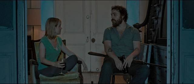Waiting for the creature to appear, Ben (Jeremy Gardner) and Abby (Brea Grant) discuss their relationship in Jeremy Gardner and Christian Stella's After Midnight (2019)
