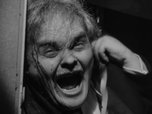 The Gamin (Adrienne Barrett)'s victim (Bruno Ve Sota) returns to taunt her in John Parker's Dementia (1953)