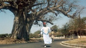 Ibrahim (Makhouredia Gueye), lacking bus fare, has to walk around the city in his quest for official ID in Ousmane Sembene's Mandabi (1968)