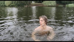 Tony (Gene Foad) senses something hostile in the water in Lindsey C. Vickers’ The Lake (1978)