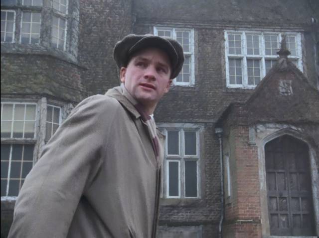 Arthur Kidd (Adrian Rawlins) arrives at Eel Marsh House in Herbert Wise's The Woman in Black (1989)