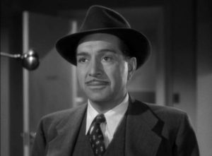 Inspector Gregg (J. Carroll Naish) investigates the murder of Dr. Mark Steele's wife in Reginald Le Borg's Calling Dr. Death (1943)