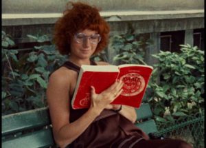 Julie (Dominique Labourier) conjures up a story while reading in a Paris park in Jacques Rivette's Celine and Julie Go Boating (1974)