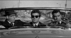 Hired killer Claude (Vince Edwards) insists on sightseeing before making a hit in Irving Lerner's Murder by Contract (1958)