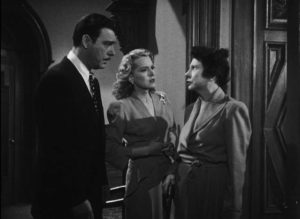 Wayne Fletcher (Chaney) and Donna Kincaid (Brenda Joyce) are confronted by eccentric Amelia Kincaid (Rosalind Ivan) in Wallace Fox's Pillow of Death (1945)