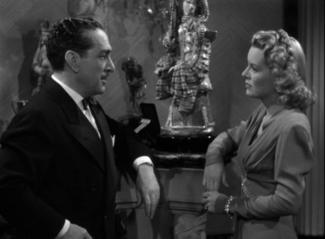 Businessman Roger Graham (J. Carrol Naish) seduces Jeff Carter (Lon Chaney)'s wife Mary (Brenda Joyce) in John Hoffman's Strange Confession (1945)