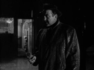 Cop Johnny Damico (Broderick Crawford) makes a mistake on a rainy night in Robert Parrish's The Mob (1951)