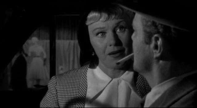 Sherry Conley (Ginger Rogers) doesn't like cop Vince Striker (Brian Keith) in Phil Karlson's Tight Spot (1955)