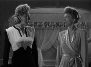 Ilona Carr (Evelyn Ankers) and Evelyn Sawtelle (Elizabeth Russell) conspire against Norman Reed (Chaney) in Reginald Le Borg's Weird Woman (1943)