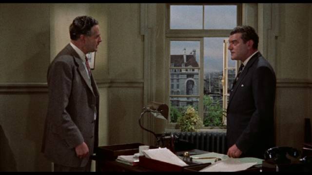 Chief Inspector George Gideon (Jack Hawkins) confronts a crooked colleague in John Ford's Gideon's Day (1958)