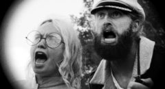 Captain Seafield (Ryland Brickson Cole Tews) and sonar expert Nedge Pepsi (Beulah Peters) are shocked by the Lake Michigan Monster (2018)