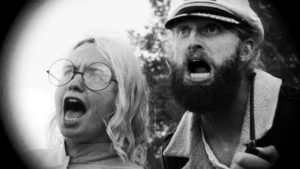 Captain Seafield (Ryland Brickson Cole Tews) and sonar expert Nedge Pepsi (Beulah Peters) are shocked by the Lake Michigan Monster (2018)