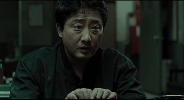 The investigation exposes Jo Byung-soon (Ryu Tae-ho)'s shameful secret in Bong Joon-ho's Memories of Murder (2003)
