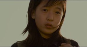 A young girl (Jeong In-seon) unwittingly reports an encounter with the killer years after the murders in Bong Joon-ho's Memories of Murder (2003)