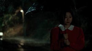 Officer Kwon Gwi-ok (Koh Seo-hee) as bait for the killer on a rainy night in Bong Joon-ho's Memories of Murder (2003)