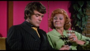 Gigolo Terry Shaw (Stephen Oliver) grows bored with rich wife Helen Golden (Rita Hayworth) in William Grefé’s The Naked Zoo (1970)