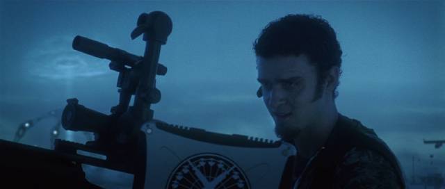 Private Pilot Abilone (Justin Timberlake) watches over the beach with a powerful sniper rifle in Richard Kelly’s Southland Tales (2006)