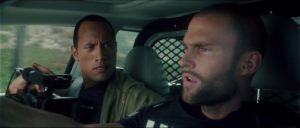 Action star Boxer Santaros (Dwayne Johnson) rides along with Officer Roland Taverner (Seann William Scott) in Richard Kelly's Southland Tales (2006)
