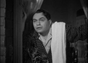 Arthur Ferguson Jones (Edward G. Robinson) realizes he'll be late for work for the first time in John Ford's The Whole Town's Talking (1935)