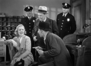Wilhelmina Clark (Jean Arthur) entertains herself by playing the gangster's moll for the cops in John Ford's The Whole Town's Talking (1935)