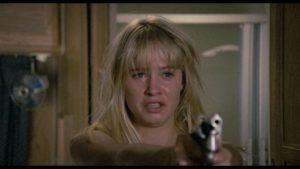 Kidnapped Daniela Foster (Josie Bissett) has to fight for her life in Umberto Lenzi's Hitcher in the Dark (1989)