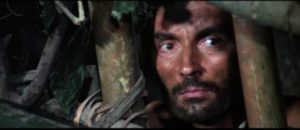 Oil prospector Robert Harper (Massimo Foschi) is caught by cannibals in Ruggero Deodato's Jungle Holocaust (1977)