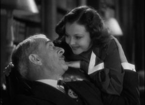 Joan (Sylvia Sidney) assures her indulgent father (George Irving) that Jerry (Frederick March) is really okay in Dorothy Arzner's Merrily We Go to Hell (1932)