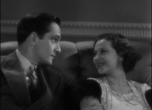 Joan (Sylvia Sidney) is attracted to Jerry (Frederic March)'s casually offhand attitude in Dorothy Arzner's Merrily We Go to Hell (1932)