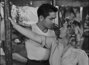 Stanton Carlisle (Tyrone Power) uses his charm on Zeena (Joan Blondell) in Edmund Goulding's Nightmare Alley (1947)