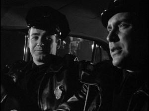 Officer Dan Purvis (Edmond O’Brien) shows rookie Rocky Barnes (Mark Stevens) the ropes in Gordon Douglas's Between Midnight and Dawn (1950)