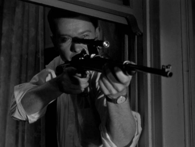 Edward Miller (Arthur Franz) fantasizes about shooting people from his rented room in Edward Dmytryk's The Sniper (1952)