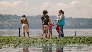 "Tiny" exploring tidal pools with some of her children in Martin Bell's Tiny: The Life of Erin Blackwell (2016)