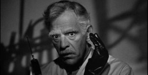 Dr. John Garth (Boris Karloff) is distracted by a murderer's impulses in Nick Grinde's Before I Hang (1940)