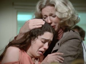 Mom (Blythe Danner) tries to comfort Gail (Kathleen Beller) after a vicious assault in Walter Grauman's Are You in the House Alone? (1978)