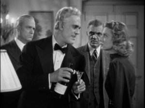 Dr. Savaard (Boris Karloff) cheerfully explains how he will kill all his guests in Nick Grinde’s The Man They Could Not Hang (1939)