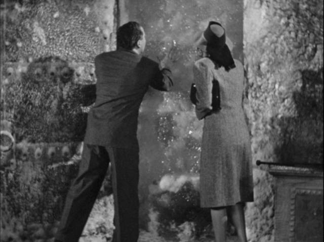 Dr. Mason (Roger Pryor) and Judith Blair (Jo Ann Sayers) discover Dr. Kravaal (Karloff) in an ice cave in Nick Grinde's The Man with Nine Lives (1940)