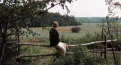 The mother (Margarita Terekhova) watches the road her husband may return on in Andrei Tarkovsky's Mirror (1975)