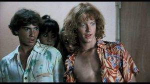 Surfer dudes Chuck (Eric Stoltz) and Bob (Jeffrey Rogers) can't believe what's happening on the beach in Randall Badat's Surf II (1983)