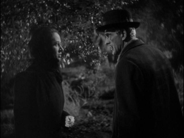 Dr. Blair (Boris Karloff) dislikes Mrs. Walters (Anne Revere)'s scheme to conceal the death of Mrs. Marcy (Dorothy Adams) in Edward Dmytryk's The Devil Commands (1941)