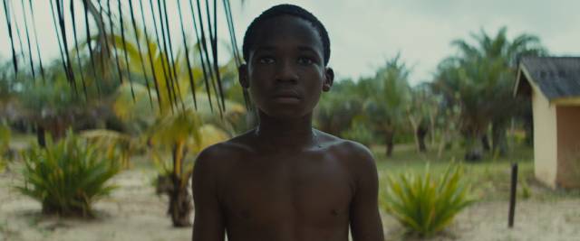 Liberated, Agu (Abraham Attah) stares into an uncertain future in Cary Joji Fukunaga’s Beasts of No Nation (2015)