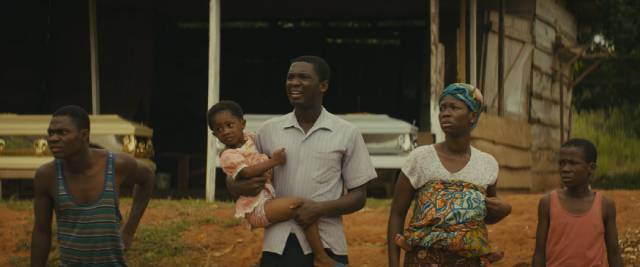 Agu (Abraham Attah)'s family try to escape as the army approaches their town in Cary Joji Fukunaga’s Beasts of No Nation (2015)