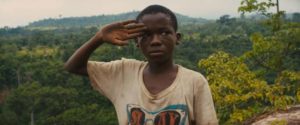 Agu (Abraham Attah) is drafted into the Commandant (Idris Elba)'s battalion in Cary Joji Fukunaga’s Beasts of No Nation (2015)