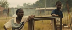 Agu (Abraham Attah) and his friends amuse themselves as war approaches in Cary Joji Fukunaga’s Beasts of No Nation (2015)