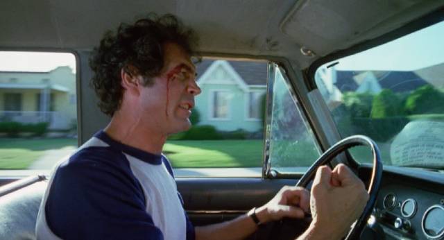 Robert Forster as a cab driver and small-time numbers runner is caught in the woman (Nancy Kwan)'s deadly plans in Norbert Meisel's Walking the Edge (1983)