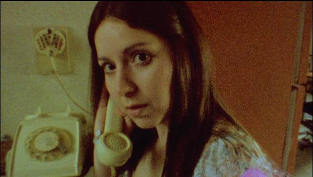 Altair answers a vaguely menacing phone call in Victor Dryere’s 1974: La posesión de Altair (2016)